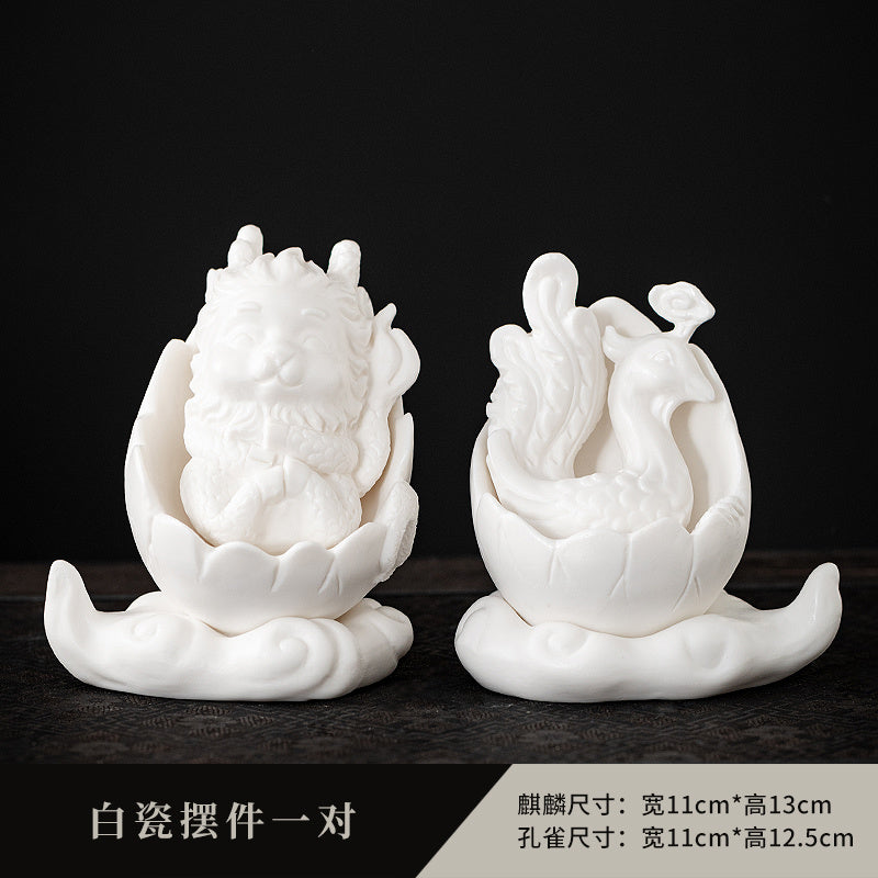 Dehua white porcelain peacock unicorn ornaments ceramic fortune-bringing crafts to resolve the living room desktop Chinese tea pet