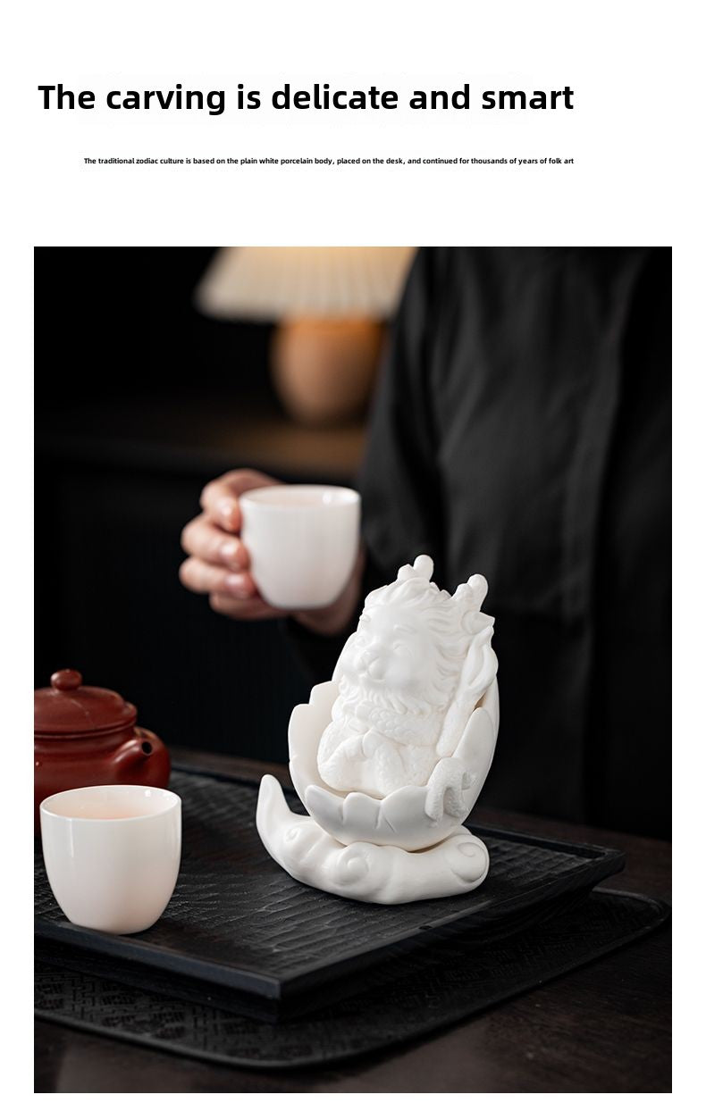 Dehua white porcelain peacock unicorn ornaments ceramic fortune-bringing crafts to resolve the living room desktop Chinese tea pet