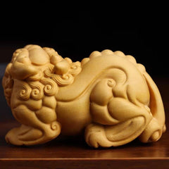 A pair of Pixiu hand-held ornaments carved from thuja boxwood for men to play with and to attract wealth.