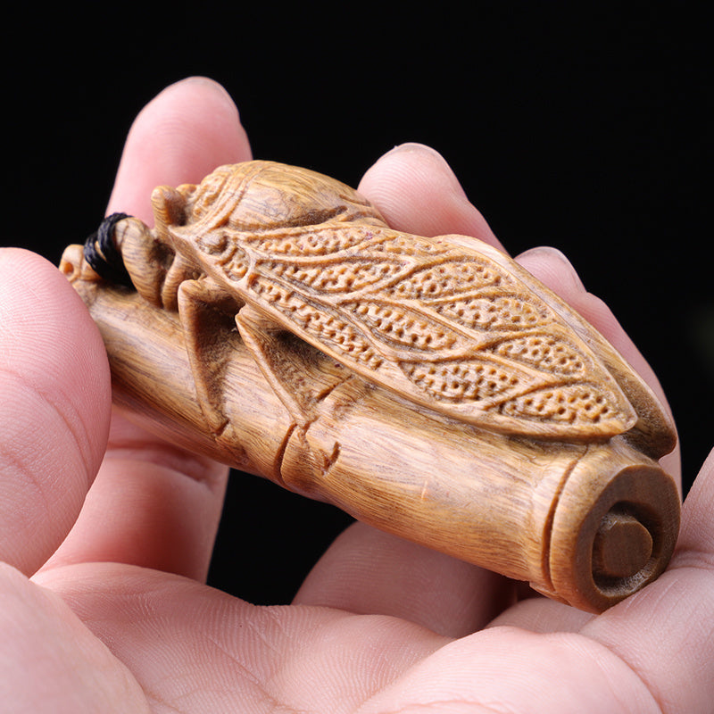 Green sandalwood hand-held pieces are amazing. Hand-carved wood crafts. Golden cicada hugging bamboo. Wooden bamboo summer cicada playthings