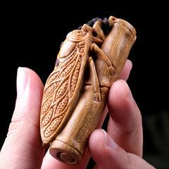 Green sandalwood hand-held pieces are amazing. Hand-carved wood crafts. Golden cicada hugging bamboo. Wooden bamboo summer cicada playthings