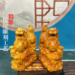 Pixiu stepping on Ruyi cliff cypress wood carving fortune-bringing Pixiu car ornaments living room decorations gifts home home desktop