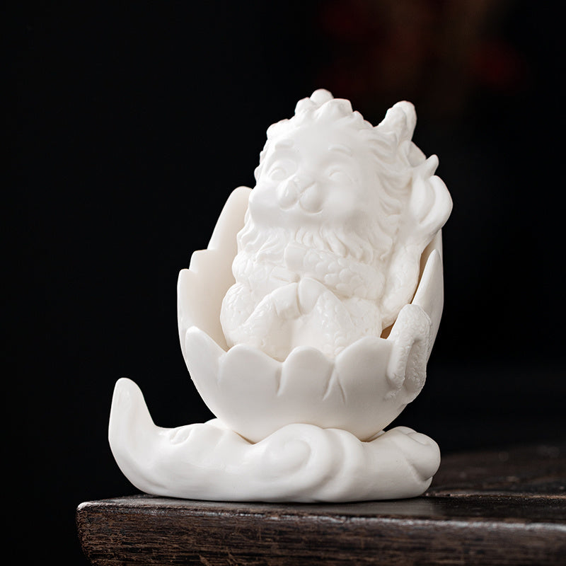 Dehua white porcelain peacock unicorn ornaments ceramic fortune-bringing crafts to resolve the living room desktop Chinese tea pet