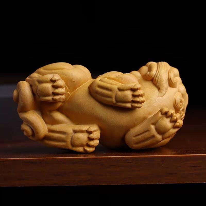 A pair of Pixiu hand-held ornaments carved from thuja boxwood for men to play with and to attract wealth.