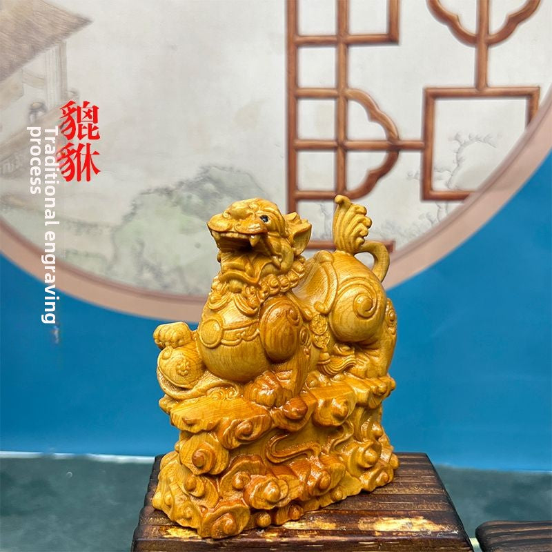 Pixiu stepping on Ruyi cliff cypress wood carving fortune-bringing Pixiu car ornaments living room decorations gifts home home desktop