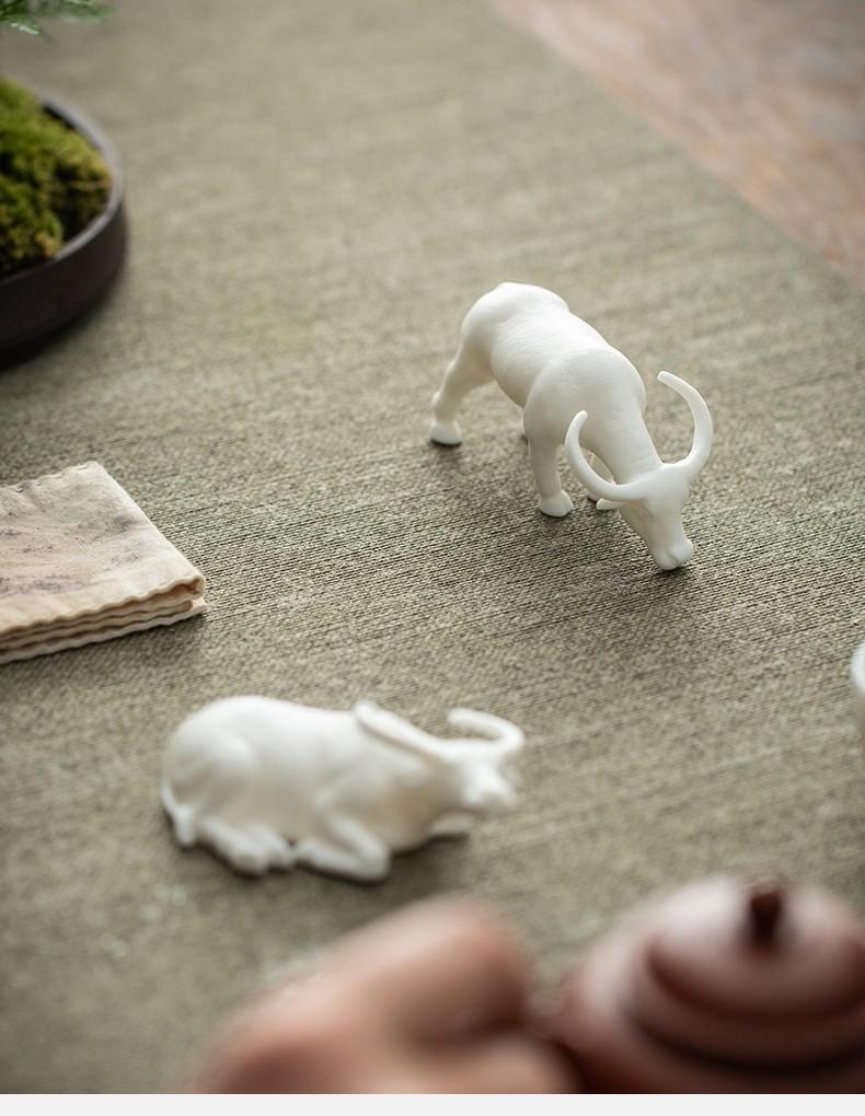 Tea pet ornaments, fine products, can be kept, Dehua white porcelain zodiac ox ceramic creative office tea table tea tray decorations