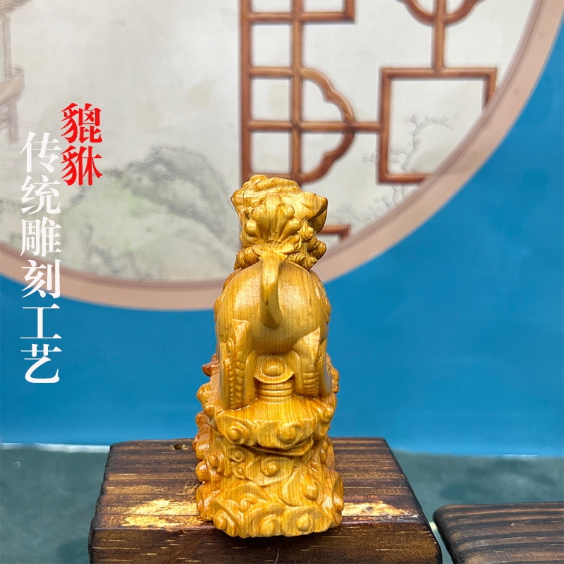 Pixiu stepping on Ruyi cliff cypress wood carving fortune-bringing Pixiu car ornaments living room decorations gifts home home desktop