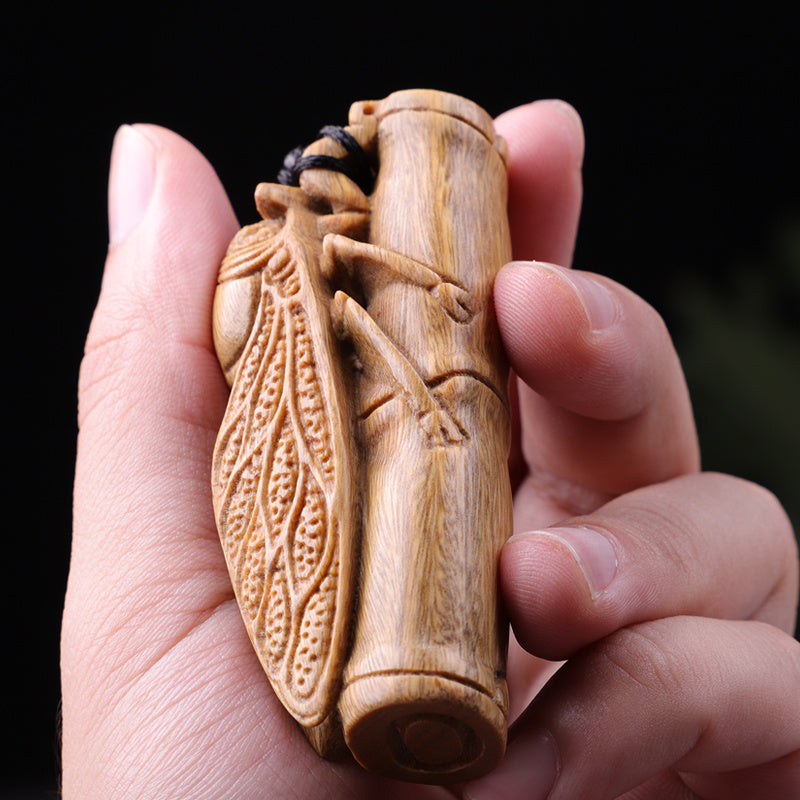 Green sandalwood hand-held pieces are amazing. Hand-carved wood crafts. Golden cicada hugging bamboo. Wooden bamboo summer cicada playthings