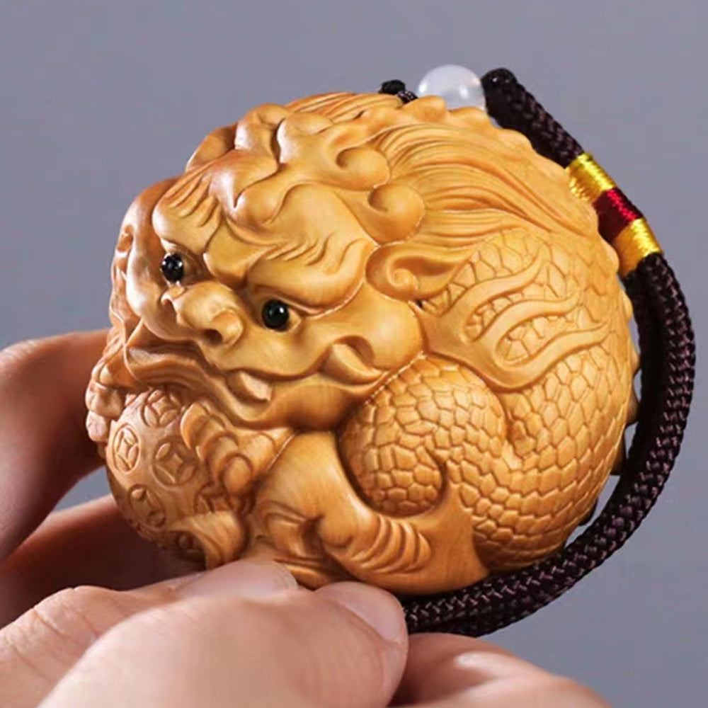 Thuja wood carving Pixiu holding a ball, which can answer any request and bring wealth and fortune, red sandalwood solid wood Pixiu massage ball, high-end hand-held piece