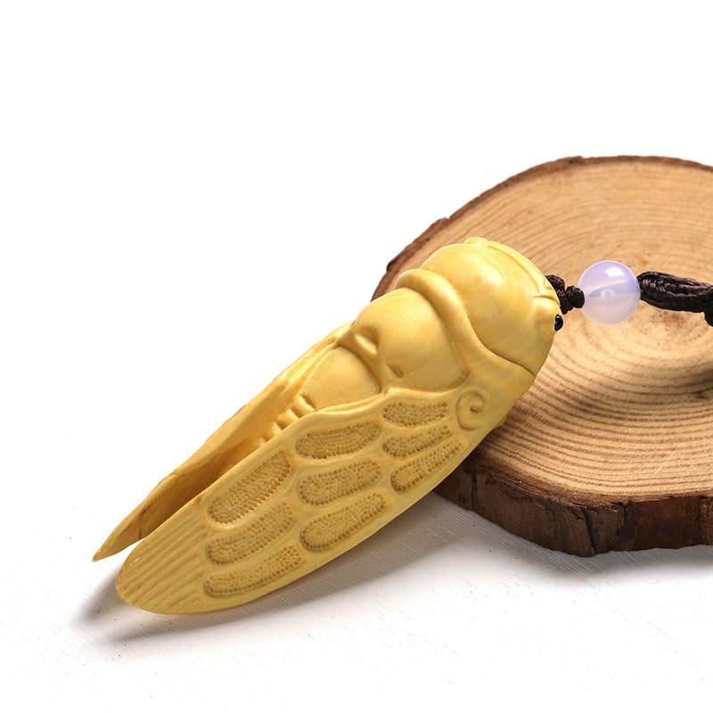 Green sandalwood hand-held pieces are amazing. Hand-carved wood crafts. Golden cicada hugging bamboo. Wooden bamboo summer cicada playthings